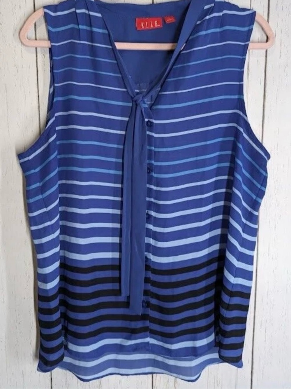 Elle sleeveless neck bow tie button down blouse